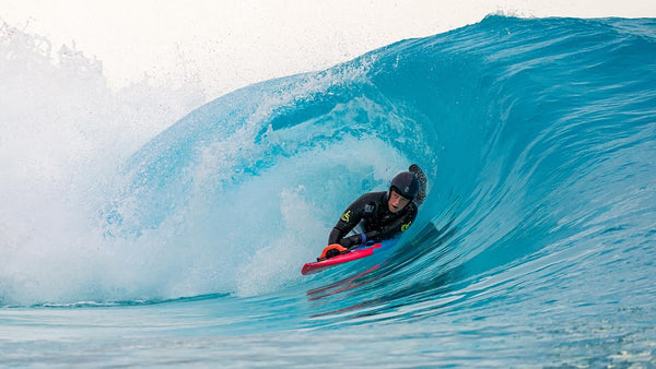 Para World Champion Jocelyn Neumueller rides a wave